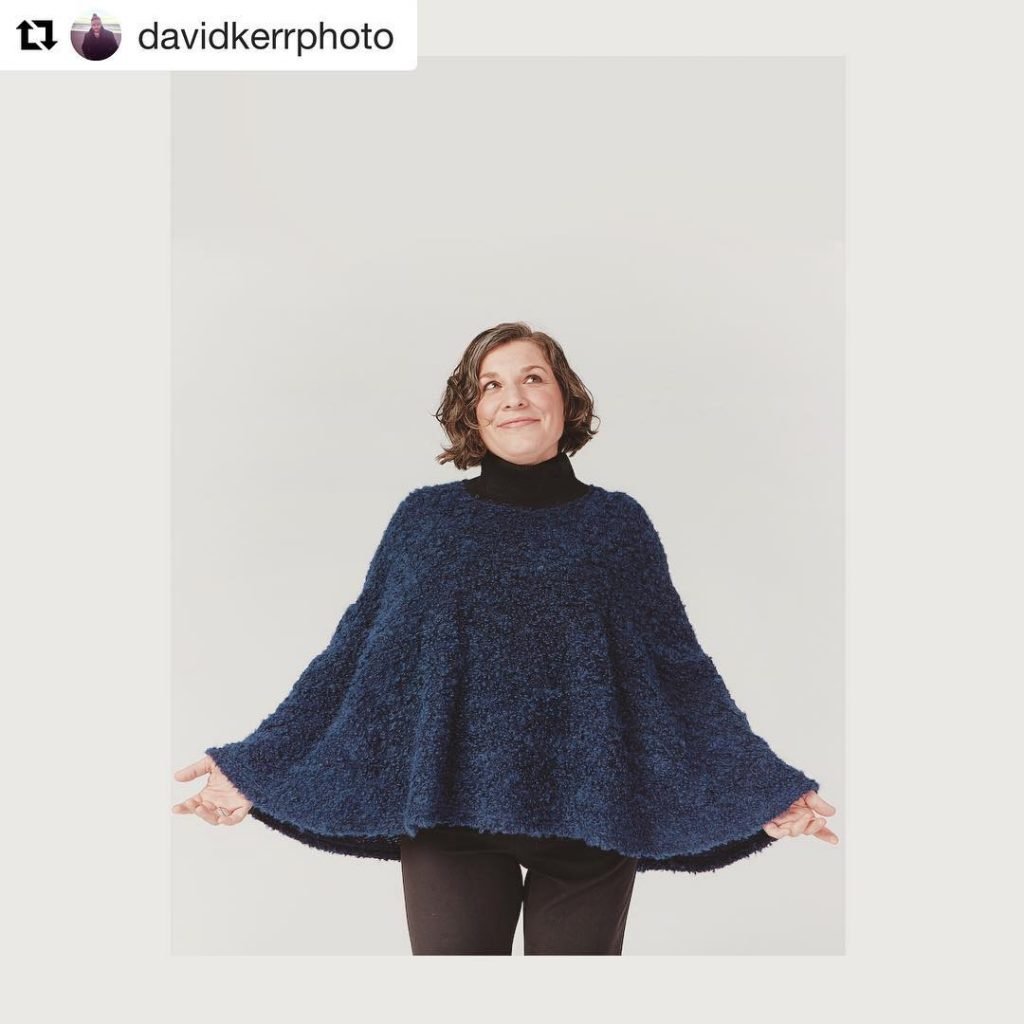 Christa is wearing a blue cape and looking up. The image is tagged "davidkerrphoto"