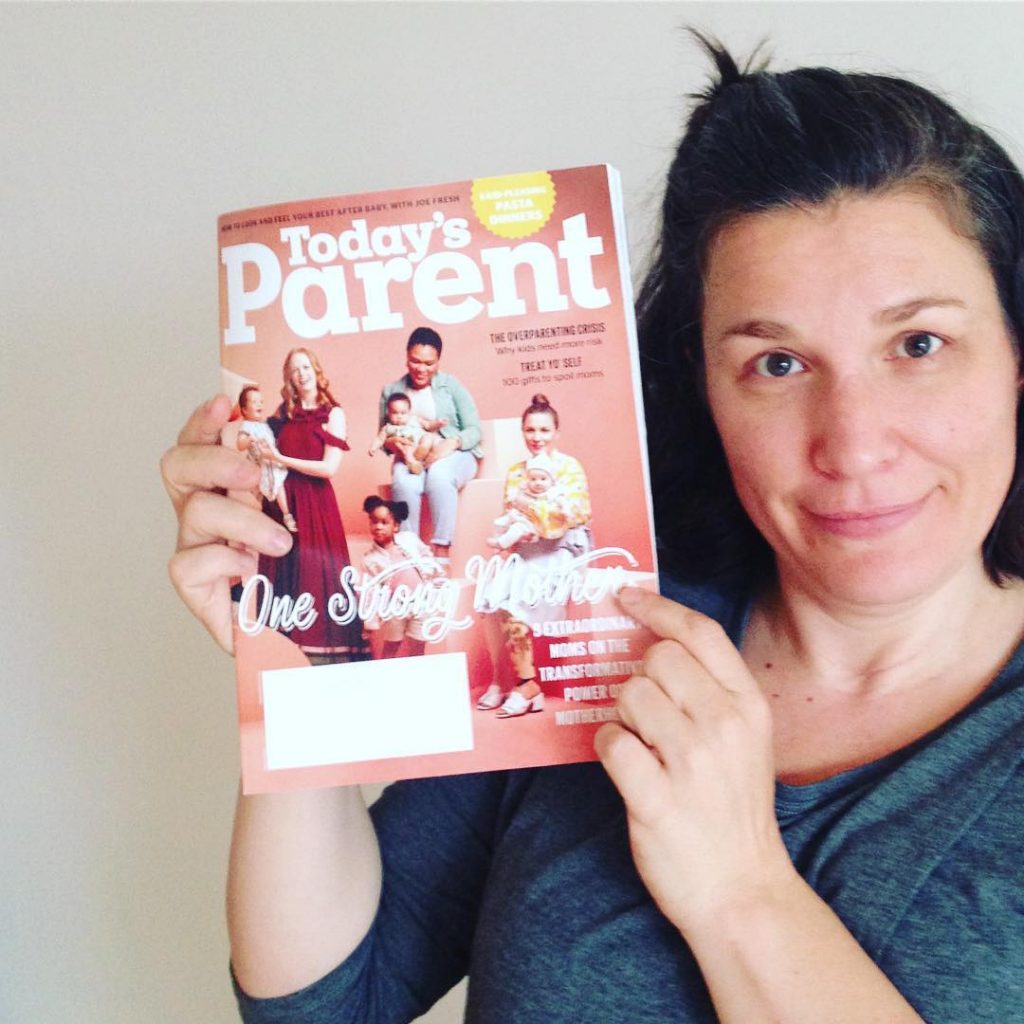 Christa is holding up a copy of Today's Parent magazine